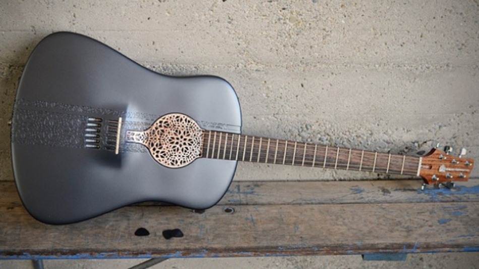 Play-a-3d-printed-acoustic-guitar-made-of-plastic-cff37fe5da